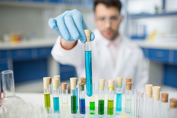 Man holding test tubes